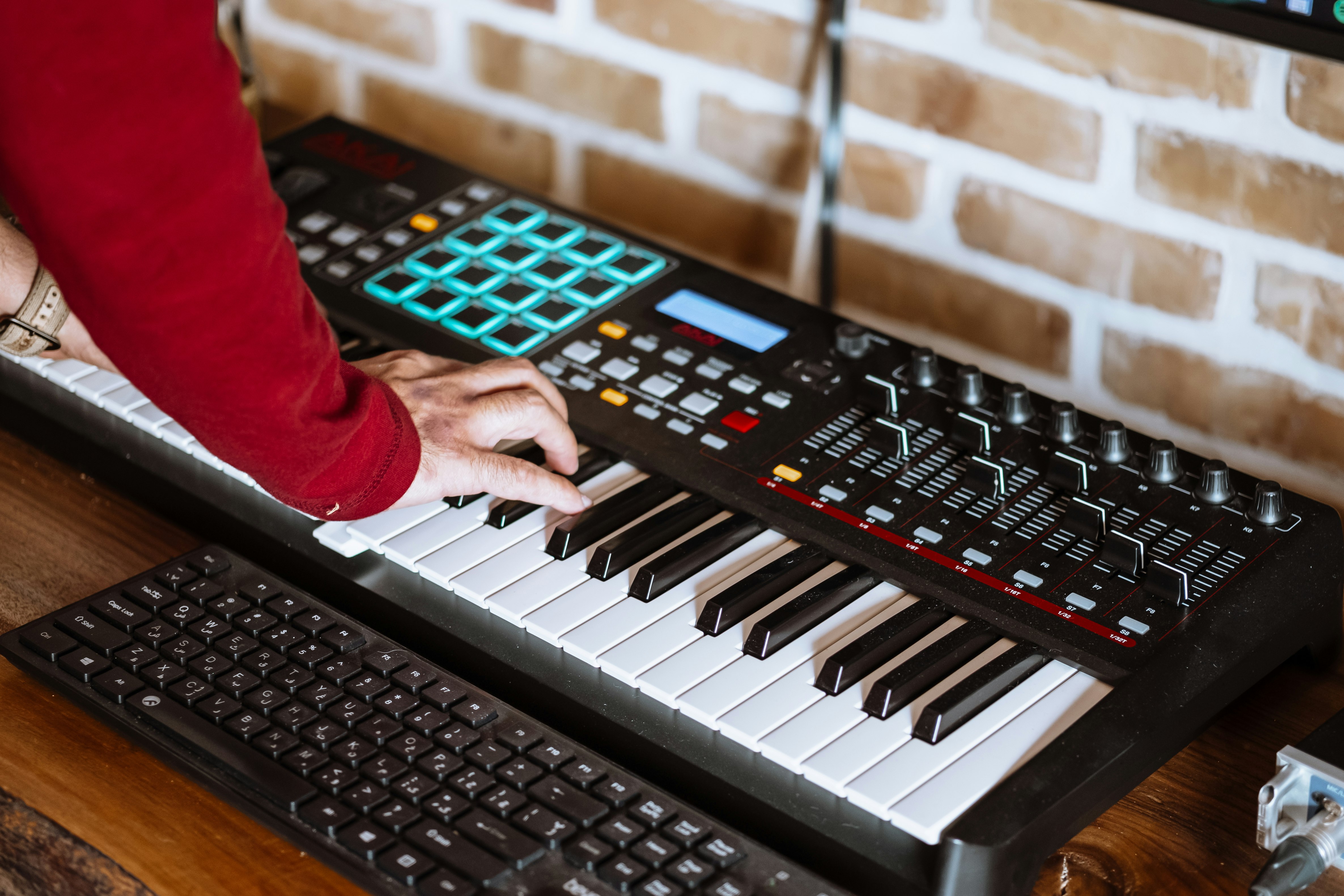 person playing black and white electric piano